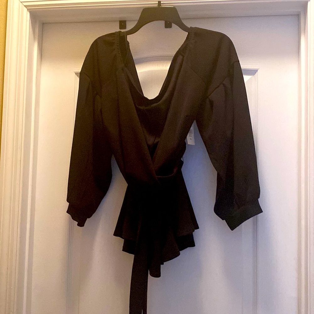 Black wrap top with belt.